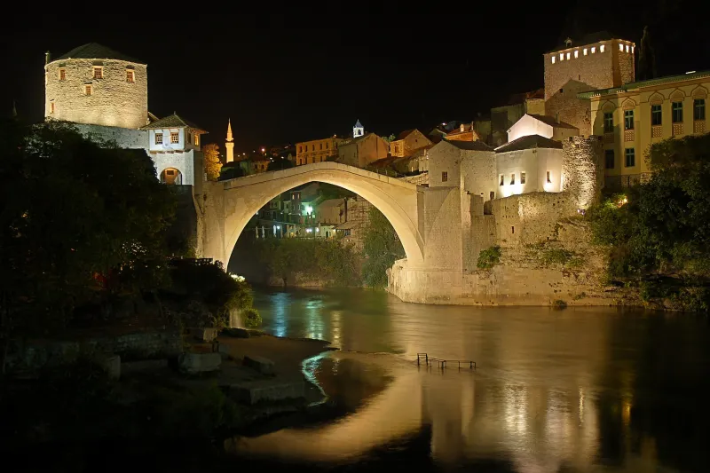 Stari Most illuminated at night in Mostar
